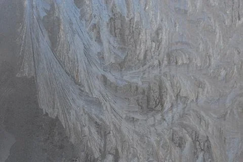 Ice patterns on winter glass Stock Photos