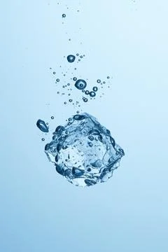 Ice piece falling in the water Stock Photos