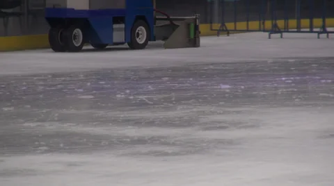 Ice polish machine, outdoor ice skating rink, machine cleaning the rink Stock Footage 34653284
