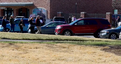 Ice protestors marching on sidewalk in Denton, Texas Stock Footage 331278221