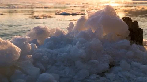 Ice on the river in the rays of the setting sun Stock Photos