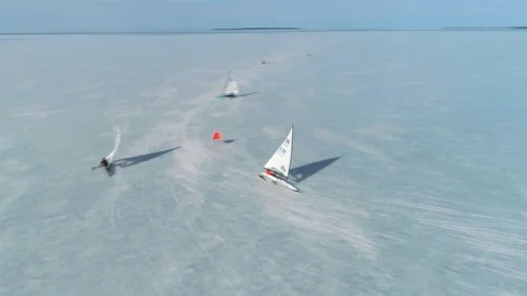Ice sailing boat nearly capsizing when passing the racing mark Stock Footage 88200985