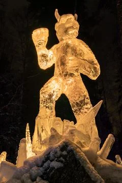 Ice sculpture figure with devil-tail motif at memorial art display Stock Photos
