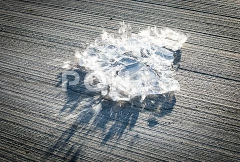 Ice sheet smashing on the floor Stock Photos