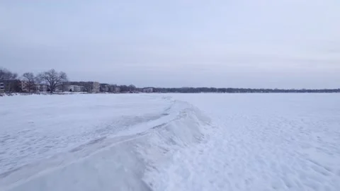 Ice Sheets jutting up from the frozen surface of Lake Monona in Madison, WI. Stock Footage 230489752