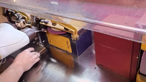 Ice skate getting sharpened on a machine, top view Stock Footage 247995975