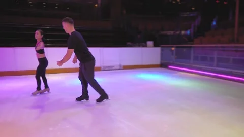 Ice skaters couple skate on empty ice arena, show rehearsal Stock-Footage 137466684