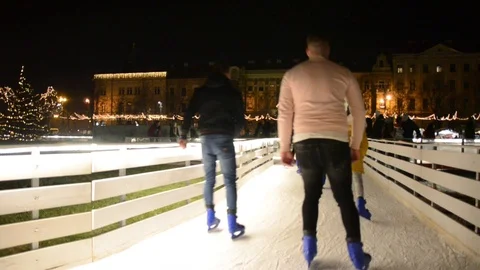 Ice skaters having fun in ice skating park at Christmas. Advent ambient Stock Footage 100631517
