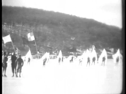 Ice-skaters, hold and maneuver a sail as they wind skate on Lake Hopatcong, Newƒ Stock Footage 75329809