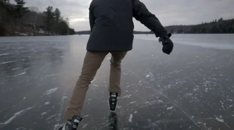 Ice Skating on Frozen Lake in Beautiful Canada Stock Footage