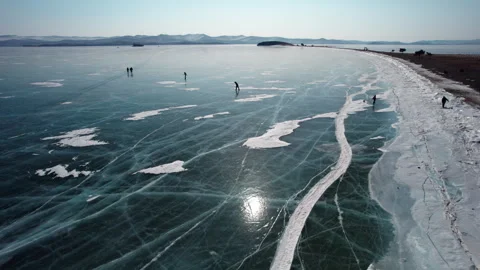 Ice skating on Lake Baikal Stock Footage 332482573