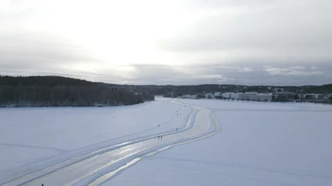 Ice Skating On A Lake Winter Drone Shot Video stock 236934072