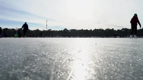 Ice skating people from below Stock Footage 148629076