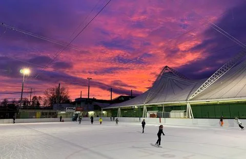 Ice-skating in sunset Stock Photos