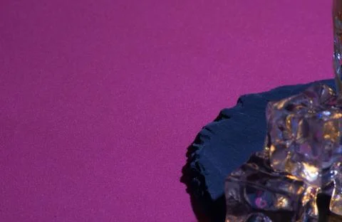 Ice with slate and fuchsia background Stock Photos