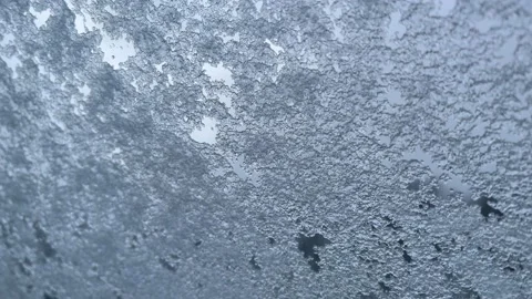 Ice/ snow crystals on window during snowstorm Stock Footage 235526599
