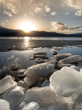 Ice stacks in horizontal image at Vineyard Beach on Utah Lake in Utah at su.. Stock Photos