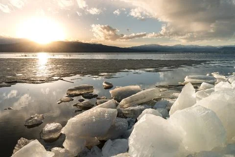 Ice stacks in horizontal image at Vineyard Beach on Utah Lake in Utah at su.. Stock Photos