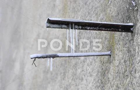 Ice Stalactites On Rusted Bars - Stock Image - Everypixel