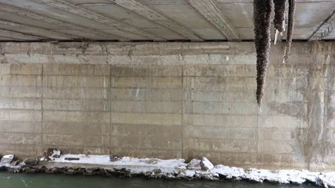 Ice stalactites under the bridge Stock Footage 107834488
