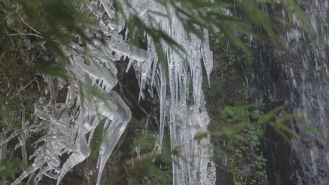 Ice stalactites on a waterfall during winter Stock Footage 102795650