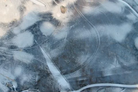 Ice surface. Texture, thin ice. The first thin crust of ice on a puddle trans Stock Photos