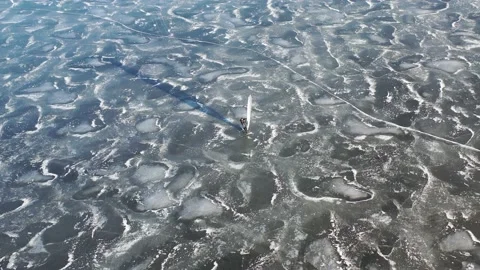 Ice surfer sailing on winter ice, aerial Stockbeeldmateriaal 170228742