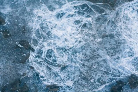 Ice texture. Ice with cracks. Cold ice background, winter frosts. Stock Photos