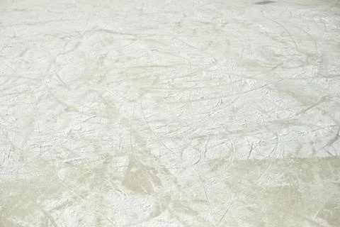 Ice texture in the stadium. Ice skating. Snow-covered surface. Stock Photos