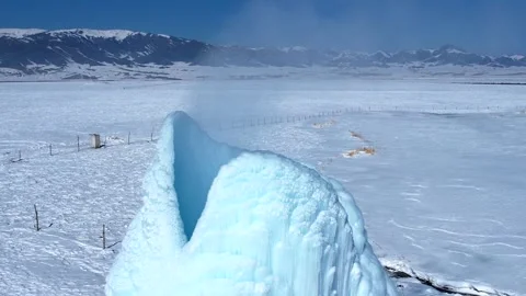 Ice volcano in snowy mountains Stock Footage 232984193