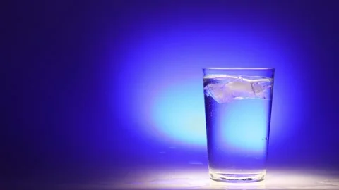 Ice Water Refreshment on Blue Gradient Stock Footage 256763132