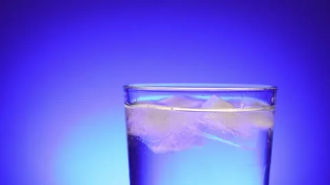Ice Water Refreshment on Blue Serenity Stock Footage 256763327