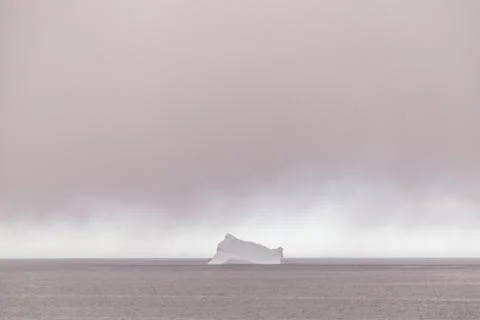 Iceberg and Rain Clouds Stock Photos