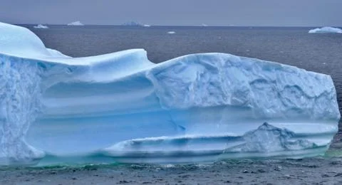Iceberg closeup with interesting wave structure and blue ice, Antarctica Stock Photos