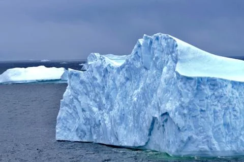 Iceberg closeup with interesting wave structure and blue ice, Antarctica Stock Photos