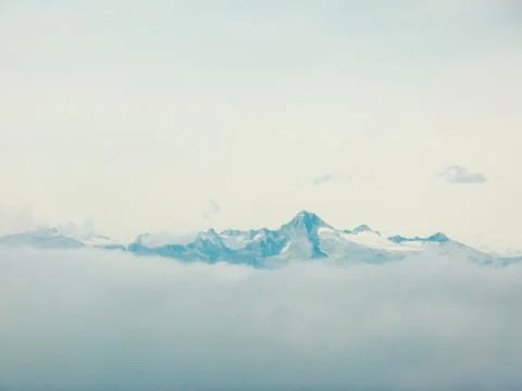 Iceberg on clouds Stock Photos