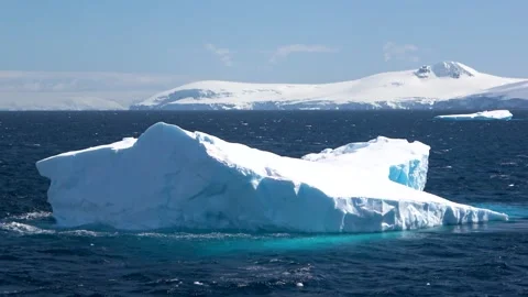 Iceberg drifting right to left zoom out Antarctica, 4K Stock Footage 332372926