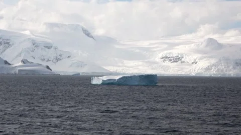 Iceberg drifting static background ocean Antarctica, 4K Stock Footage 332372787