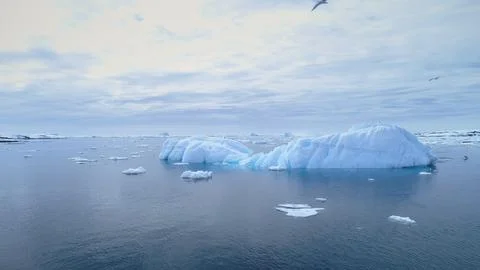 Iceberg float in clear water ocean aerial view Stock Photos