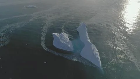 Iceberg float open ocean water drone aerial view Stock Photos