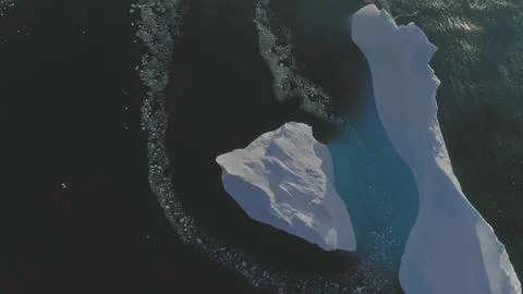Iceberg float open ocean water drone aerial view Stock Photos