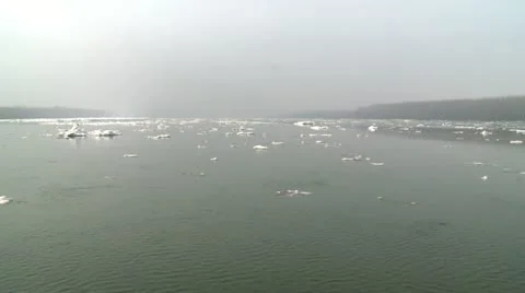 Iceberg, floating on a river, smaller pieces of ice Stock Footage 11165161