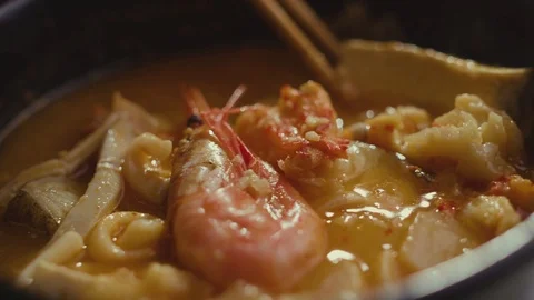 Iceberg lettuce leaf falling on a bun while making a burger. Stock Footage 121744622