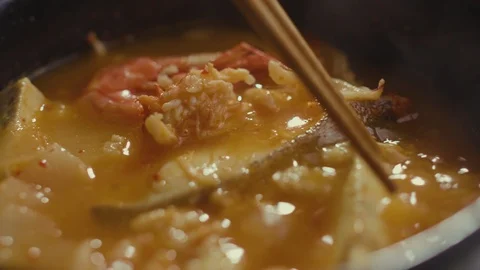 Iceberg lettuce leaf falling on a bun while making a burger. Stock Footage 121744696
