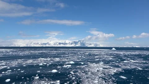 Iceberg with mountains and small ice rocks motion, Antarctica, 4K Stock Footage 332371541