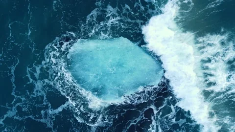 Iceberg in the ocean, Huge Chunks of Blue Ice floating on the waves, Arctic Stock Footage 198747512