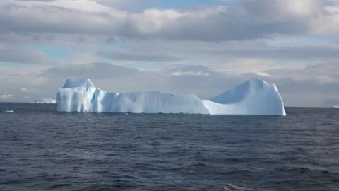 Iceberg silhouette backlit dramatic light Antarctica, 4K Stock Footage 332372807