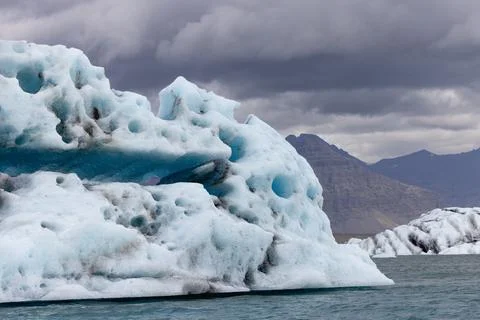 Iceberg swinging back and forth after breaking off. Stock Photos