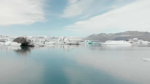 Icebergs Floating in the Lagoon Sweeping Drone Stock Footage 186786410