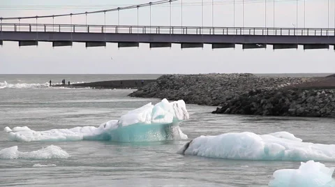Icebergs floating under the bridge Stock Footage 57313334